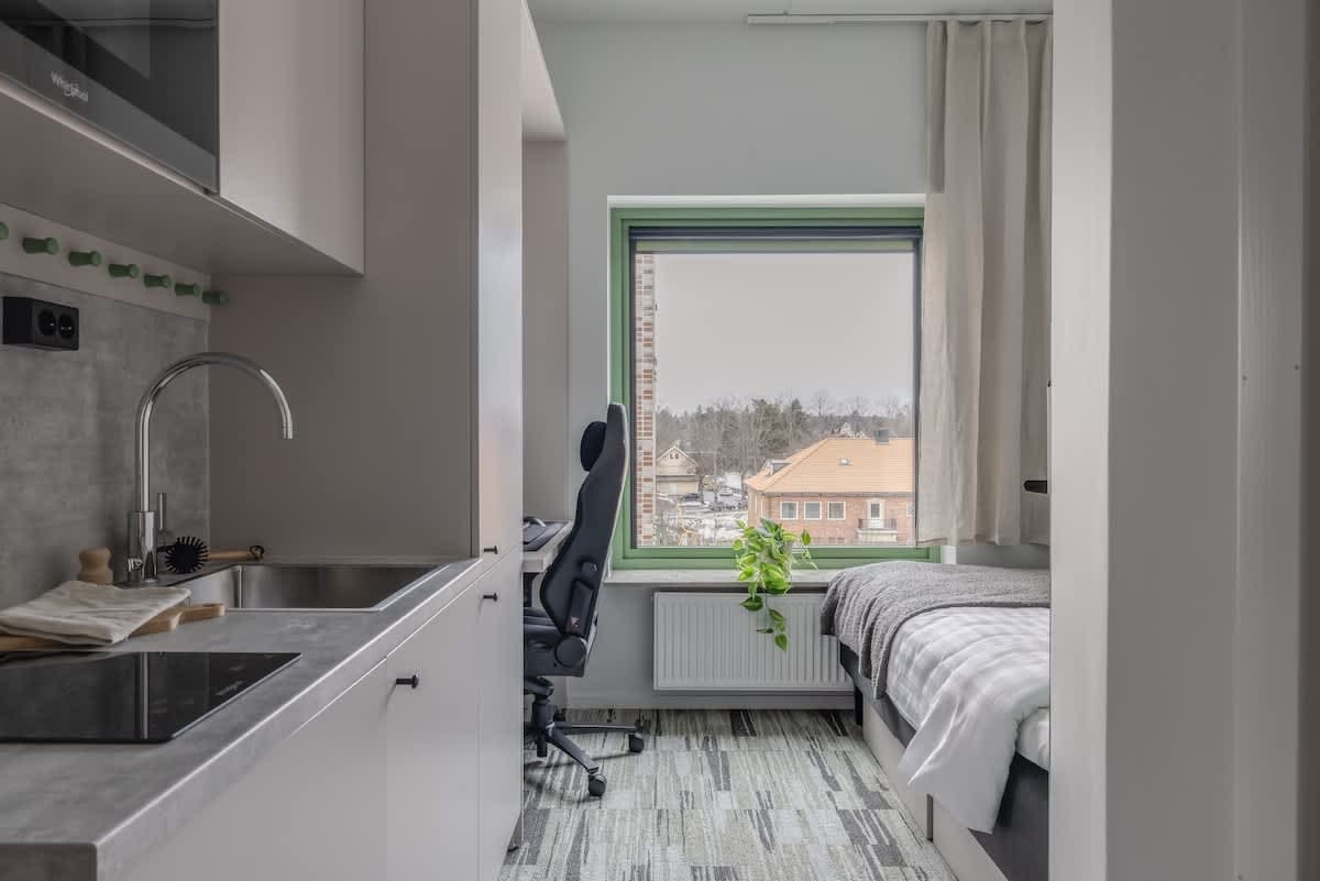 HomeX Hotel Täby shared kitchen and lounge common area with terrace