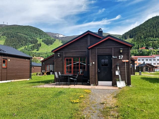 Detached cabin in Åre Strand, Åre, with south-facing patio and fireplace near ski lifts and lake