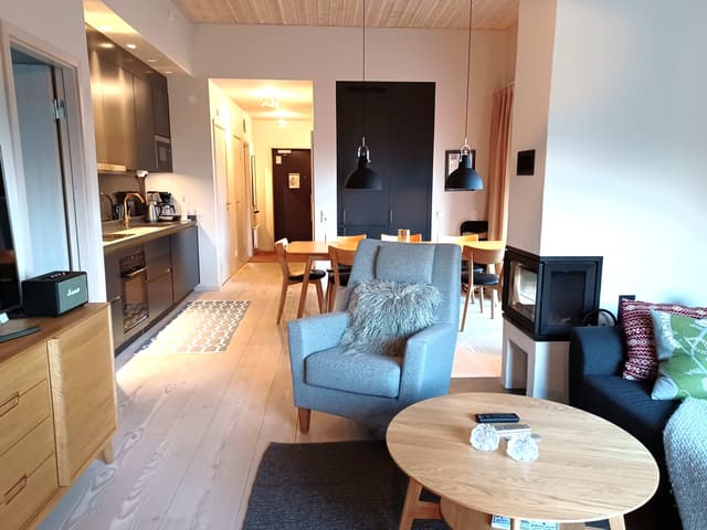 Modern apartment in Åre near the square with fireplace, private sauna, balcony and easy access to ski lifts.
