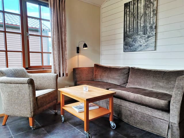 Detached cabin in Åre Strand, Åre, with south-facing patio and fireplace near ski lifts and lake