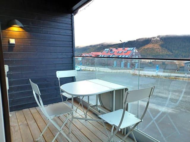 Modern apartment in Åre near the square with fireplace, private sauna, balcony and easy access to ski lifts.