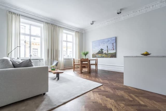 Renovated apartment in Östermalm, Stockholm with balcony and herringbone flooring.