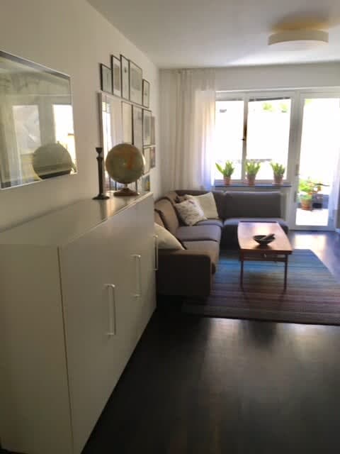 Bright living room with sofa and art in Södermalm apartment; Master bedroom with double bed in Södermalm; Single bedroom in Södermalm; Additional single bedroom in Södermalm; Equipped kitchen in Södermalm; Private terrace in Södermalm