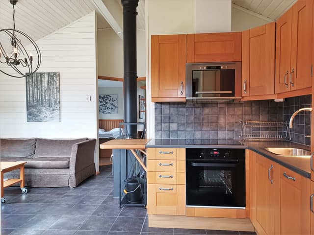 Detached cabin in Åre Strand, Åre, with south-facing patio and fireplace near ski lifts and lake