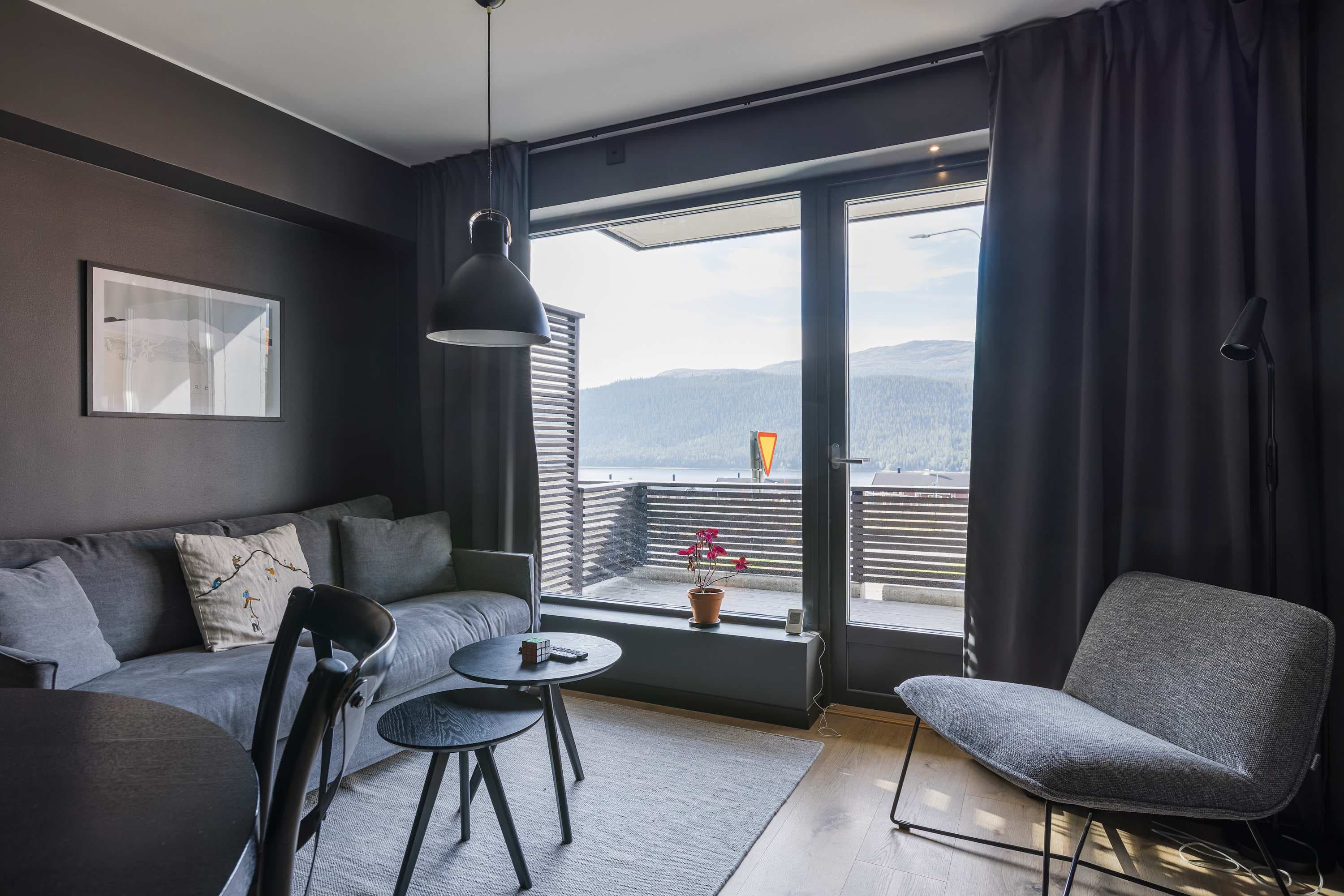 Modern kitchen in Åre apartment, stylish bathroom interior, cozy living area with mountain view