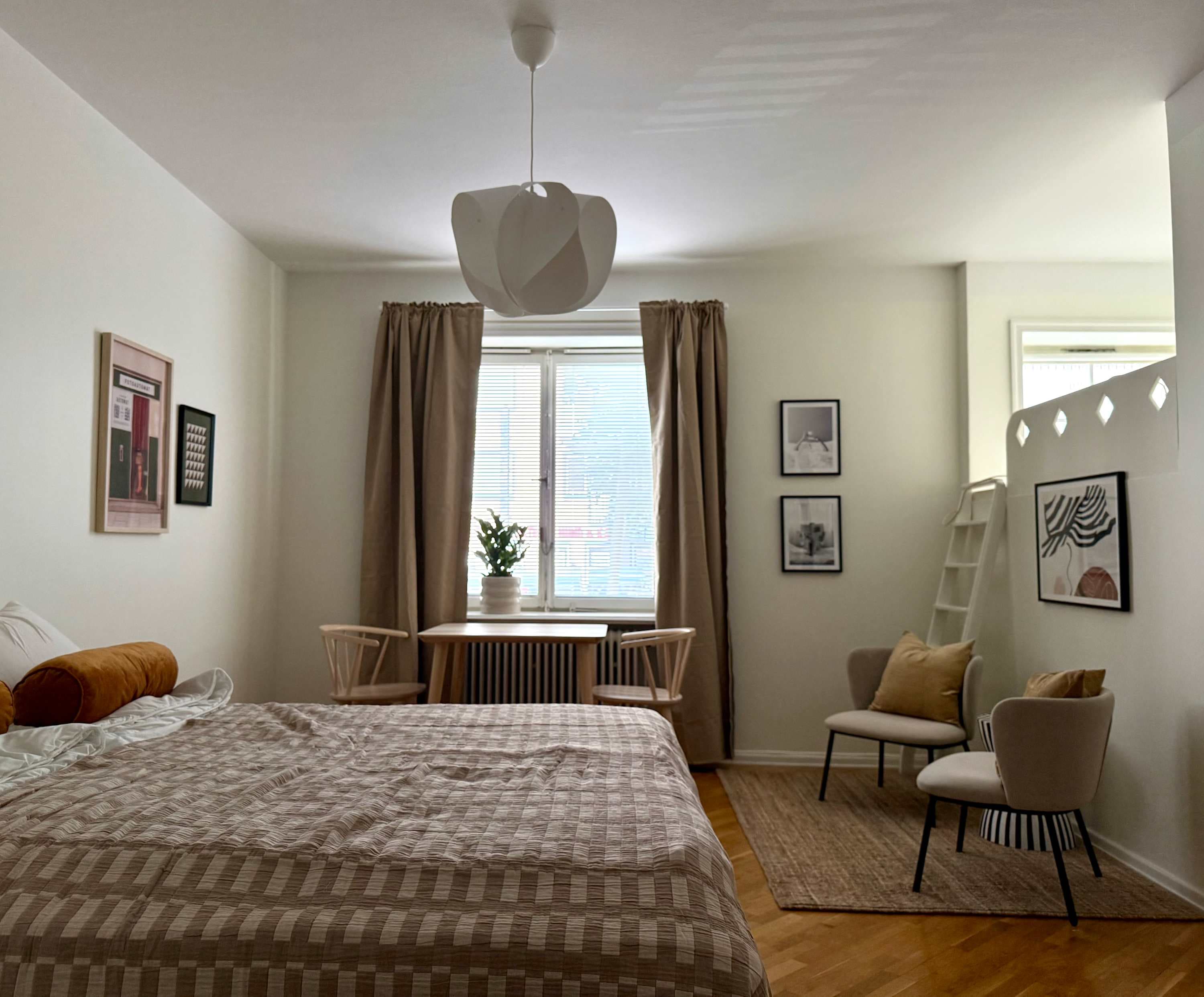 Södermalm studio interior, cozy living area by the water, modern kitchenette, café-lined streets nearby