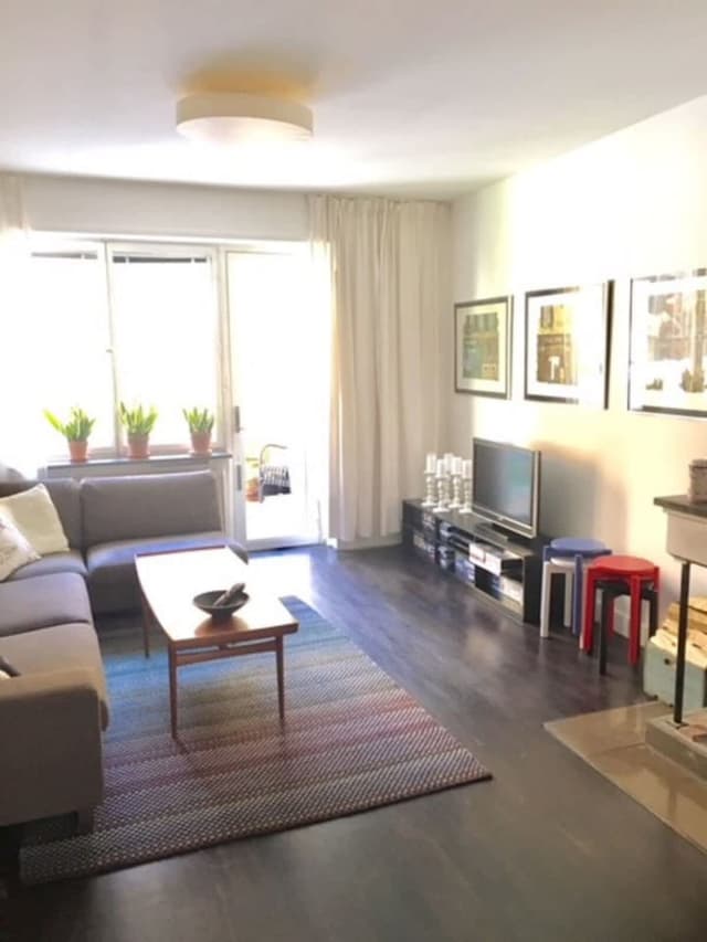 Bright living room with sofa and art in Södermalm apartment; Master bedroom with double bed in Södermalm; Single bedroom in Södermalm; Additional single bedroom in Södermalm; Equipped kitchen in Södermalm; Private terrace in Södermalm