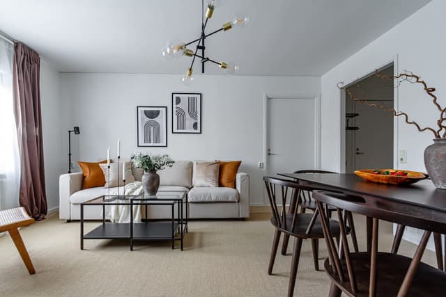 Windowless bedroom, cozy living space, modern kitchenette in budget SoFo apartment, Södermalm