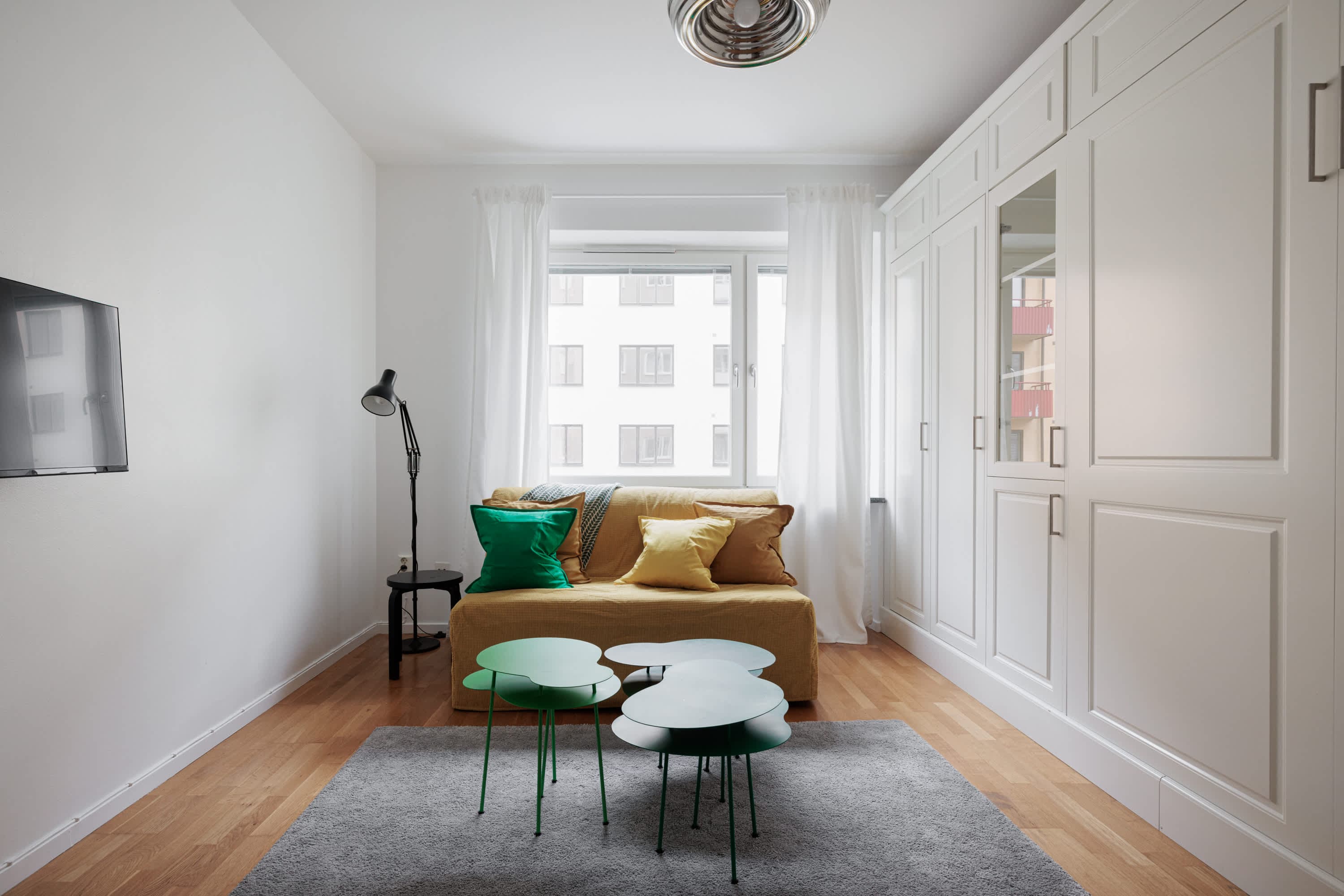 Interior of cozy Hornstull studio apartment near scenic waterfront paths