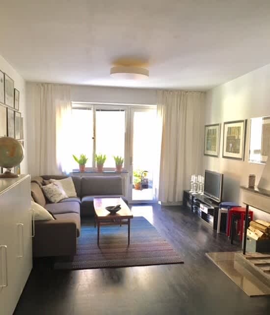 Bright living room with sofa and art in Södermalm apartment; Master bedroom with double bed in Södermalm; Single bedroom in Södermalm; Additional single bedroom in Södermalm; Equipped kitchen in Södermalm; Private terrace in Södermalm